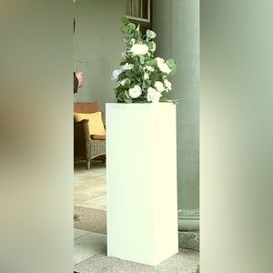 4 white pillars for wedding with artificial flowers included